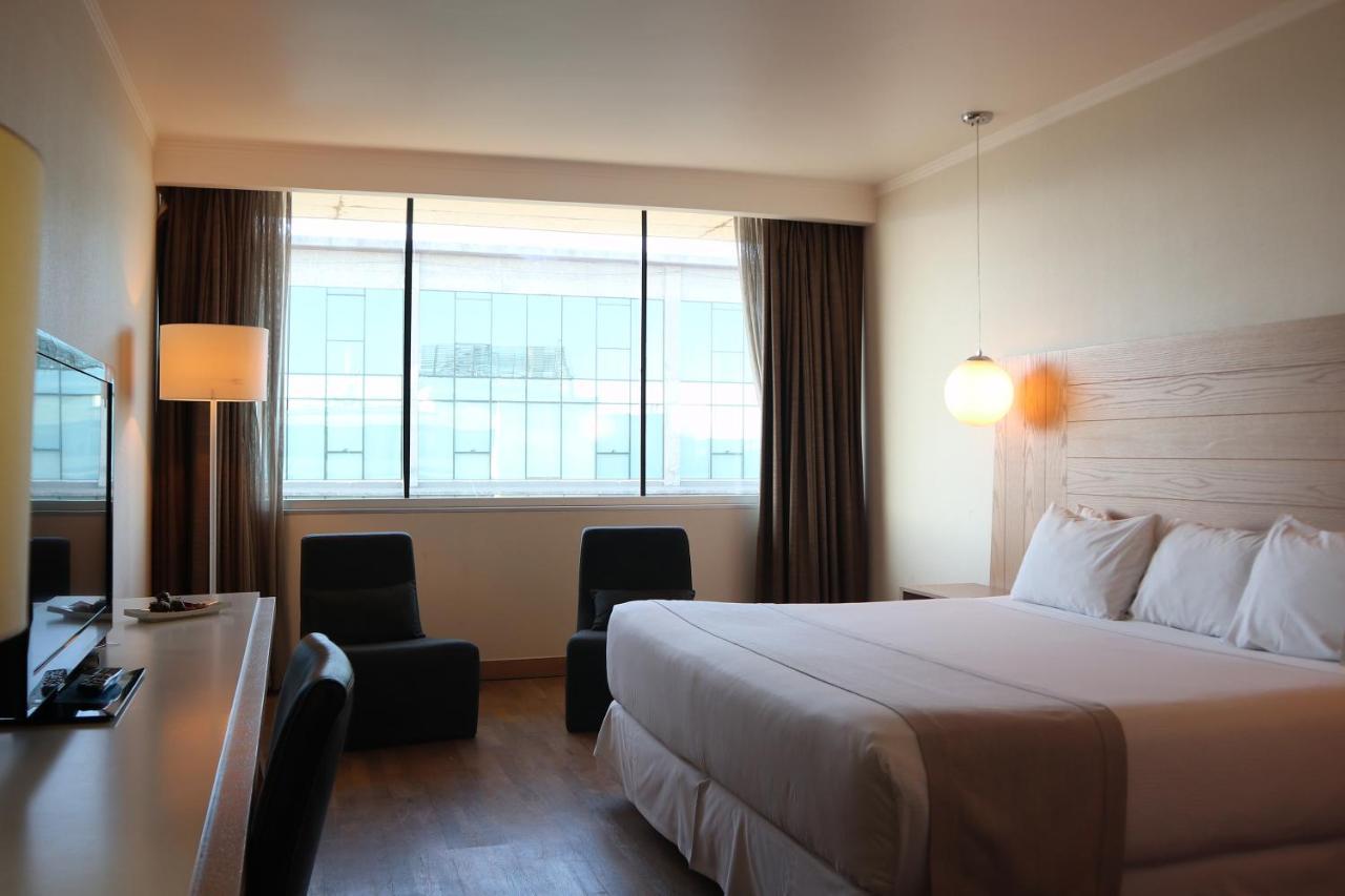 Wyndham Concepcion Pettra Hotel Kültér fotó A room at the hotel